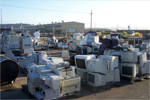 A lot filled with computers and other old electronics is shown here.