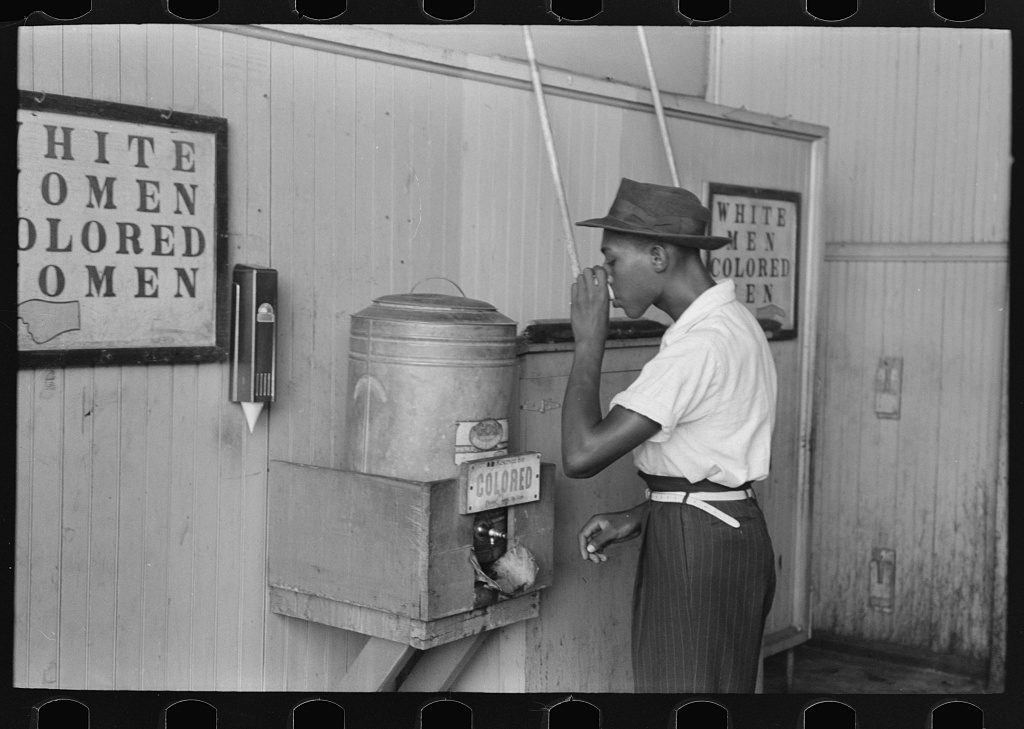 On May 18, 1896, the Supreme Court ruled separate-but-equal facilities constitutional on intrastate railroads. For some fifty years, the Plessy v. Ferguson decision upheld the principle of racial segregation. Across the country, laws mandated separate accommodations on buses and trains, and in hotels, theaters, and schools. (Water cooler in streetcar terminal, Oklahoma City, Oklahoma, contributed by Russell Lee, photographer, 1903-1986, published July 1939, Library of Congress at http://hdl.loc.gov/loc.pnp/pp.fsaowi)