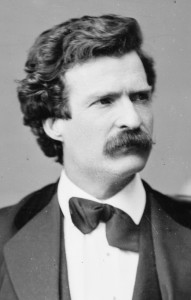 Black and white photo of Mark Twain as a young man, with dark hair and a thick mustache.