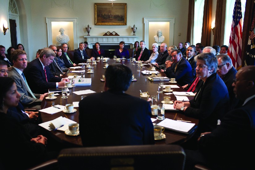A photo of cabinet members holding a meeting in the Cabinet Room.