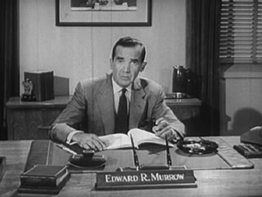 An image of Edward R. Murrow seated behind a desk.