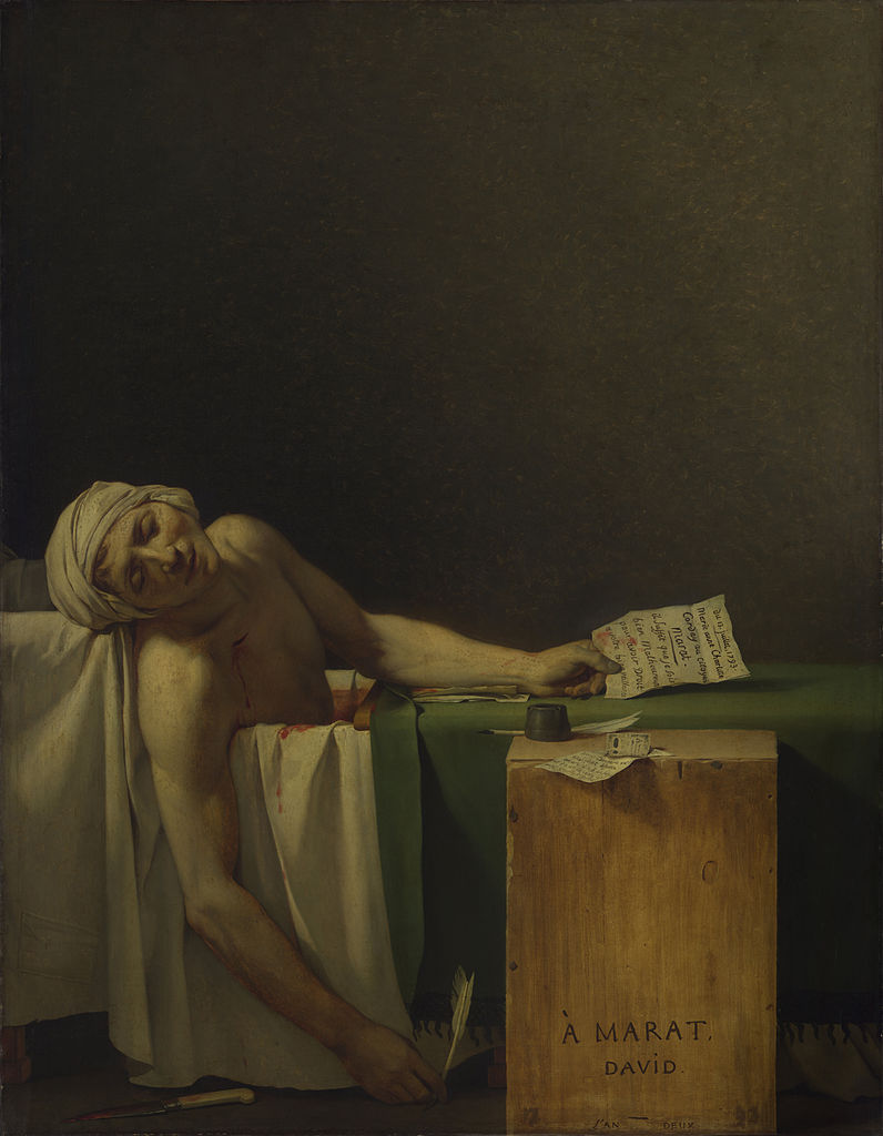 Marat, dead in his bathtub. A blanket is pulled over the tub, but some of the water is shown to be bright red. Marat still holds a letter in one hand and a quill in the other.