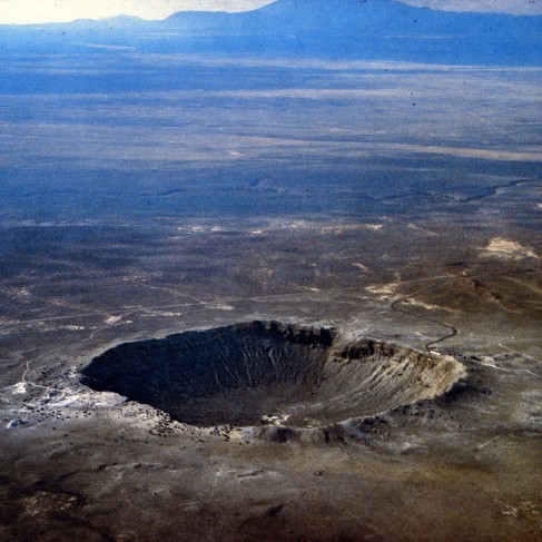 Aerial Photograph of Meteor Crater in Arizona. The nearly perfect bowl-shaped crater is seen on the flat desert plain of Northern Arizona.