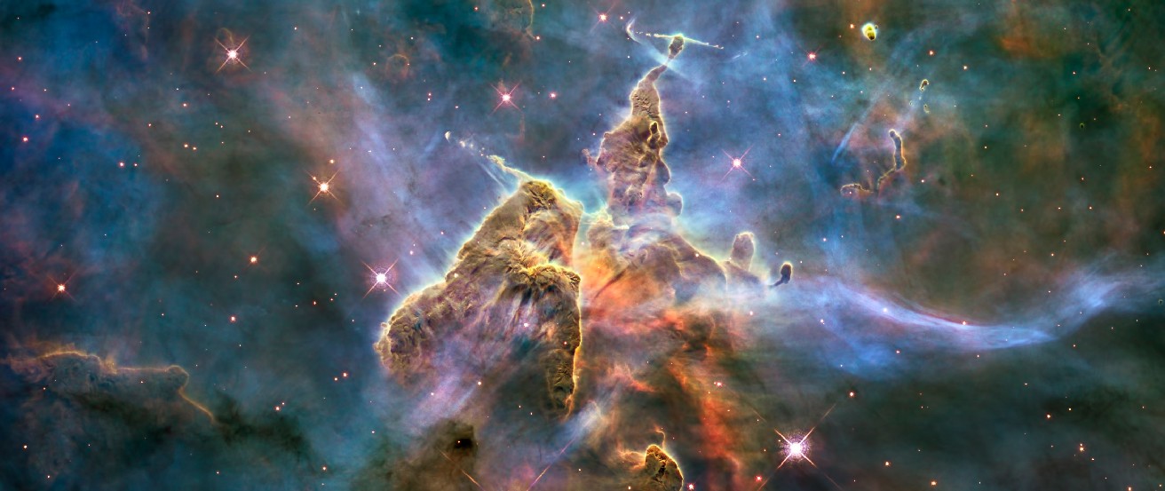 The Carina Nebula. This image shows two cone-shaped nebulae within the larger Carina Nebula. At the very top, or apex, of each gaseous 
