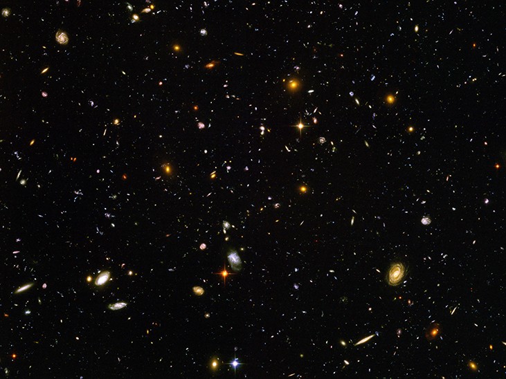 An image shows the stars and objects visible in the Ultra-Deep Field.