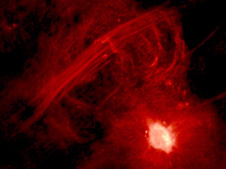 Central 10 Light-Years of the Galaxy. The bright region at lower right is Sagittarius A* and the straight filaments running from lower left to upper right are collectively known as 
