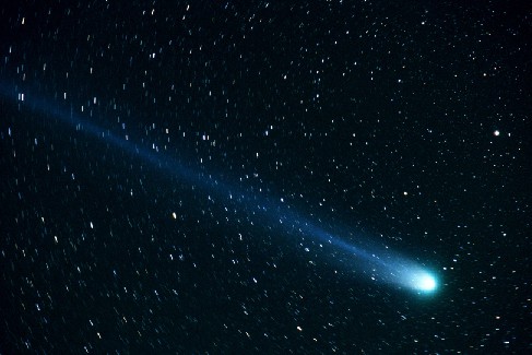 Comet Hyakutake. The nucleus is seen at lower right, and the tail stretched from the nucleus to upper left in this photograph from 1996.