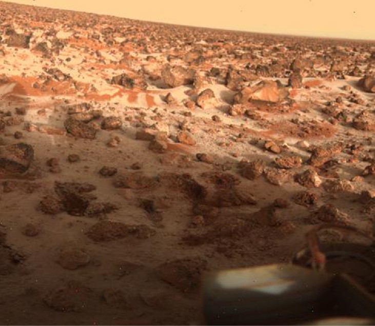 Winter on Mars. A thin layer of white frost covers the soil and parts of some of the rocks and boulders in this Viking 2 image.