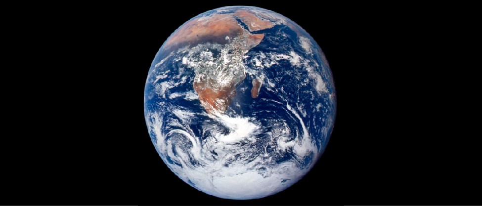 Image of Earth from Space. This photograph shows Africa, the Arabian Peninsula, Madagascar, and Antarctica surrounded by the Atlantic & Indian oceans. Numerous cloud formations are scattered across the globe.