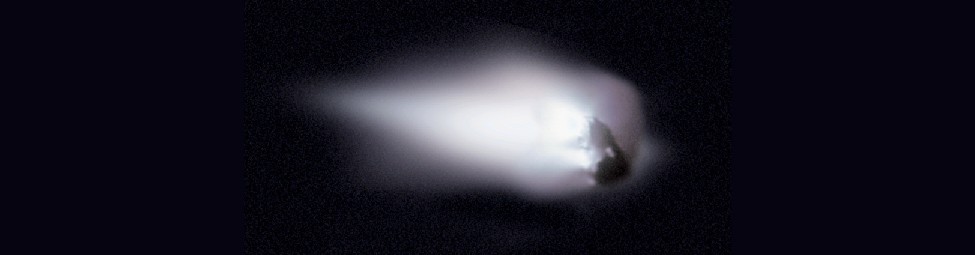 Close-up of Comet Halley. Jets of material escaping from the nucleus are seen on the left side of this photograph. The