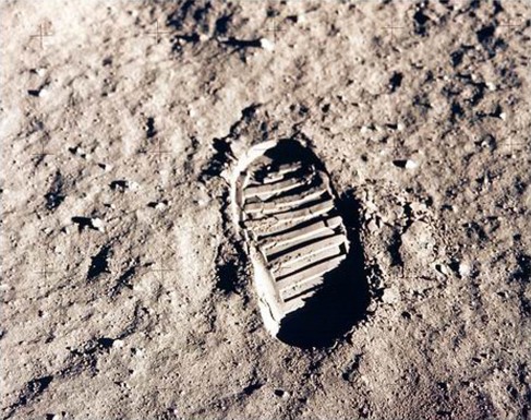 Footprint on the Moon. Photograph of a single boot print in the grey Lunar soil.
