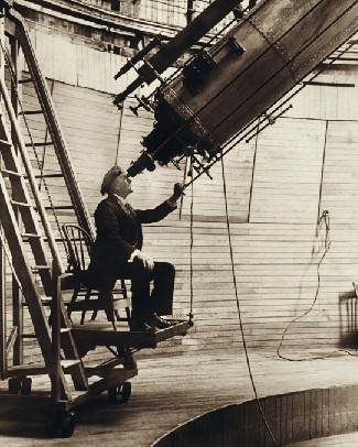 This is a photograph of Percival Lowell seated at the eyepiece of the 24-inch refractor near Flagstaff, Arizona.