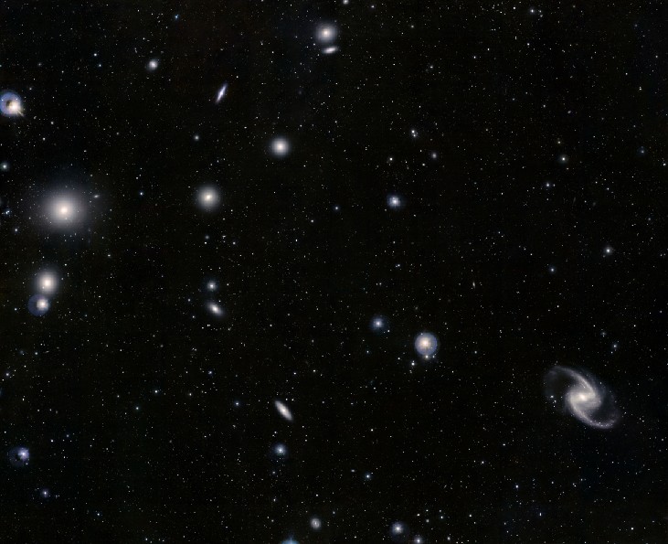 Image of the Fornax Cluster of Galaxies. Many elliptical and spiral galaxies are scattered throughout the image.