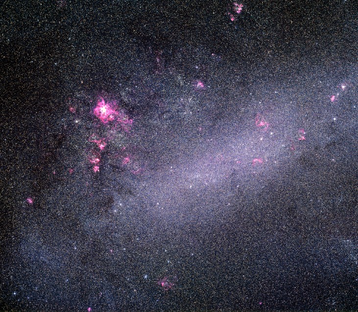 Photograph of the Large Magellanic Cloud. Unlike spiral or elliptical galaxies, the Large Magellanic Cloud does not have a distinct shape and is classified as an irregular galaxy. The main portion of the galaxy is an elongated