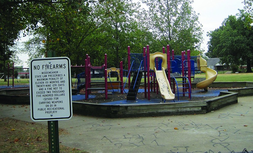 A photo of a sign that reads No Firearms. Misdemeanor. State law prescribes a maximum penalty of eleven (11) and twenty-nine (29) days and a fine not to exceed two thousand five hundred dollars ($2500) for carrying weapons on or in public recreational property