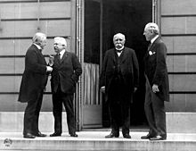 David Lloyd George, Vittorio Emanuele Orlando, Georges Clemenceau, and Woodrow Wilson at a council in Versailles.