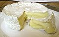 An image of Camembert on a plate, a cheese specialty from Normandy.