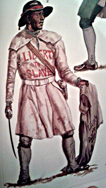 Drawing of a single black man dressed in leggings and a frock that is belted at the waist. The words 'Liberty to Slaves is blazed onto the top of the frock. The man also wears a brimmed hat, and is carrying a coat in one hand and a sword in the other.
