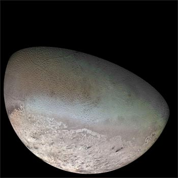 Image of Neptune’s moon Triton shows cratered surface with mounds and round pits.