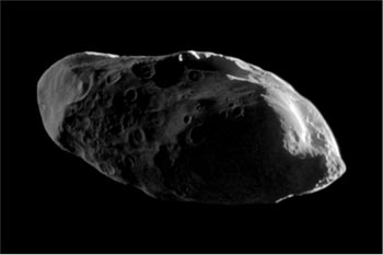 Image of Saturn’s satellite Prometheus, small and elongated in shape showing ridges and valleys.