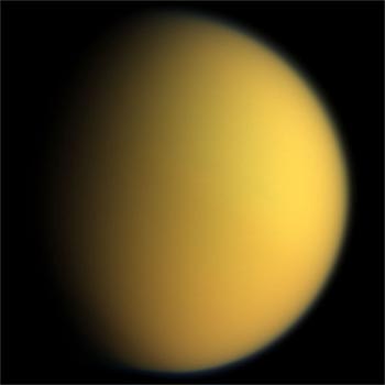 Image of Saturn’s Satellite Titan showing its thick orange atmospheric haze.