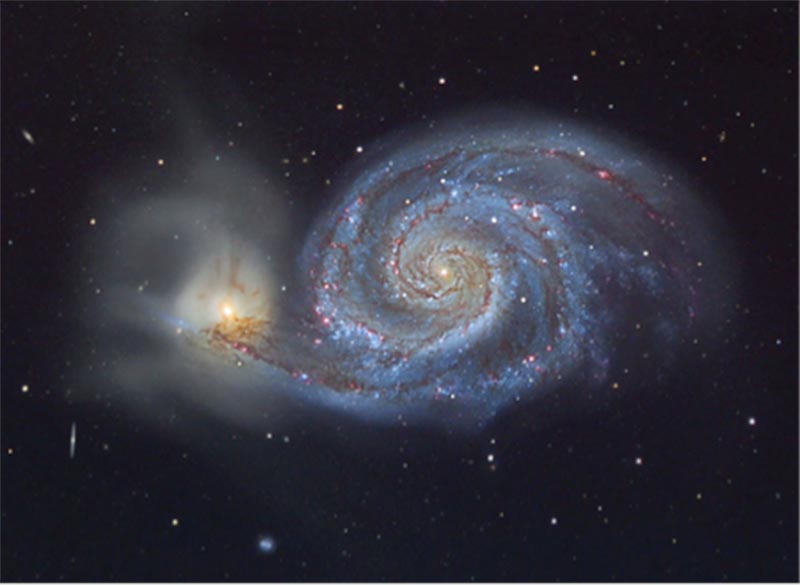 A photograph of the Whirlpool galaxy, a spiral galaxy.