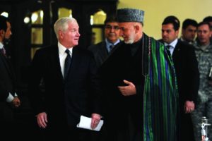 An image of Robert Gates speaking with Hamid Karzai.