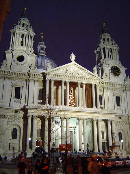 Picture of the west front of the cathedral. It shows a boldly projecting Classical portico with paired columns and two towers on either side.