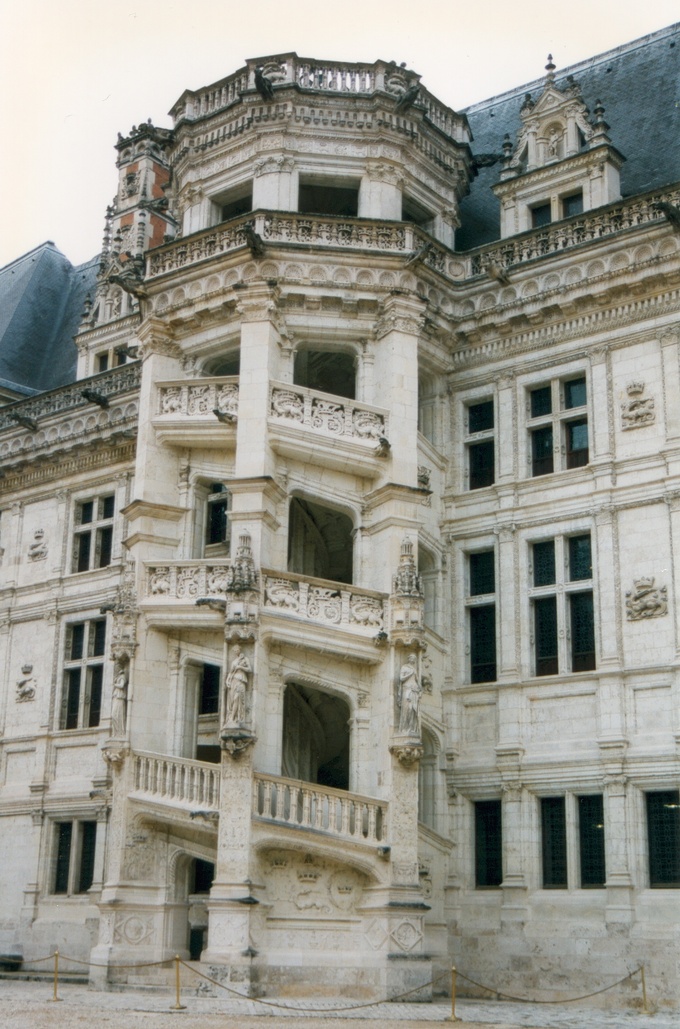 The spiral staircase is covered with fine bas-relief sculptures and looking out onto the château's central court.