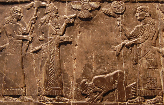 Photo shows detail view of a scene from the black limestone Assyrian sculpture. The Assyrian king Shalmaneser III receives tribute from Sua, king of Gilzanu, The Black Obelisk.