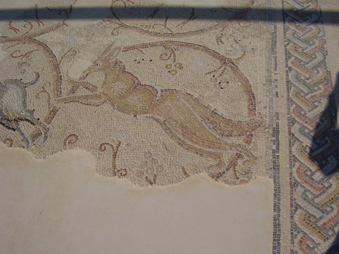 This is a photo of a Gaza synagogue mosaic. It shows a depiction of Orpheus, a Greek mythological figure who was commonly associated with David and used in Byzantine art.