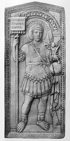 This is a photo of the consular diptych of Probus. In this diptych, Probus is portrayed in elaborate armor and he holds a globe with a Victory on top.