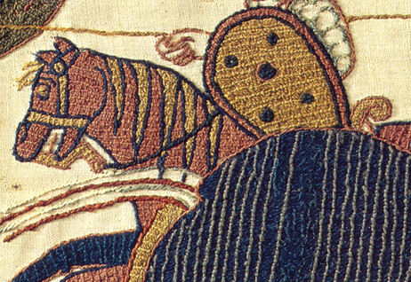 Tapestry image shows a man on a horse.
