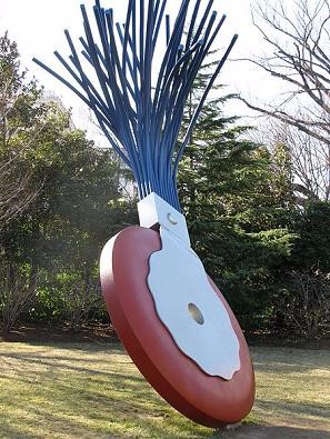 Picture of a large typewriter eraser on display outside.