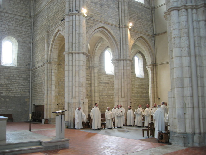 Image of monks gathering inside the Acey Abbey.