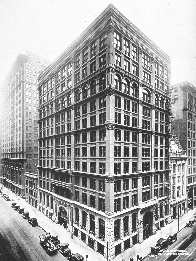 Black and white photo of the Home Insurance Building. Shows features of the Chicago School: steel frame with masonry cladding.