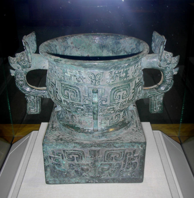 An elaborately decorated vessel with two handles.