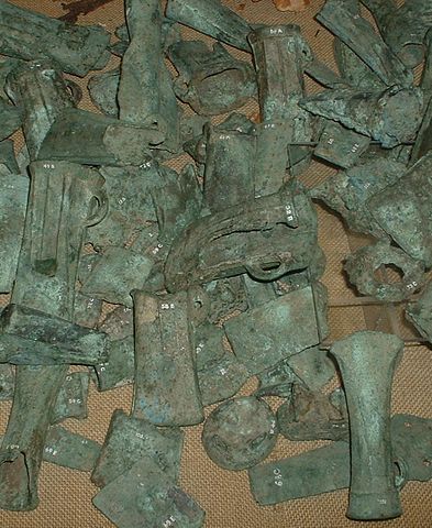 Photo depicts a pile of discarded bronze castings.