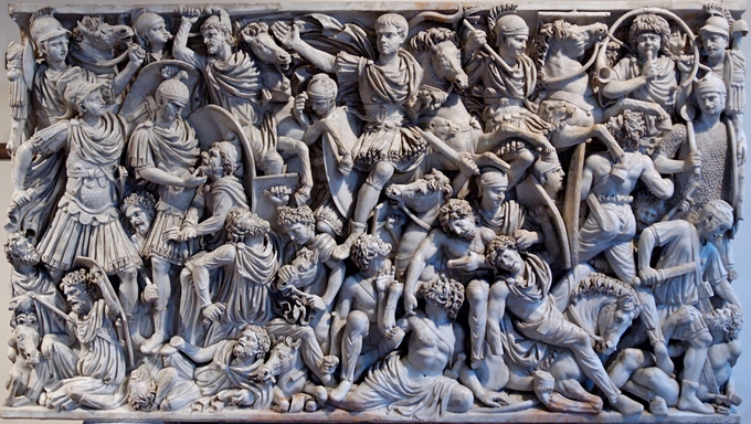 This is a closeup photo of the Ludovisi Sarcophagus. The panel relief depicts a densely populated Roman battle scene.