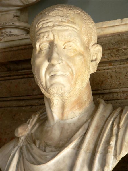 This is a photo of the portrait of Trajanus Decius, a man with a receding hairline and a lined face. His expression shows that he is anxious and concerned.