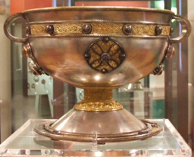 The chalice is a large, two-handled silver cup, decorated with gold, gilt bronze, brass, lead pewter and enamel.