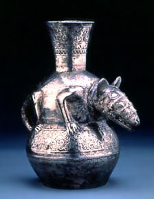 Bronze bottle with an animal carved in its middle.