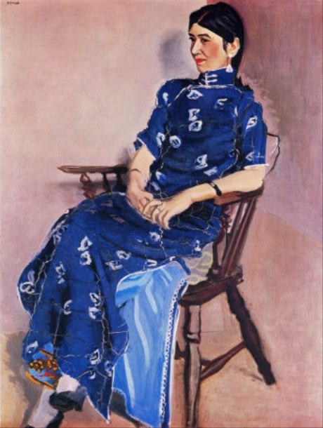 Chin-Jung is depicted leaning back in a chair, looking relaxed, wearing a bright blue dress.