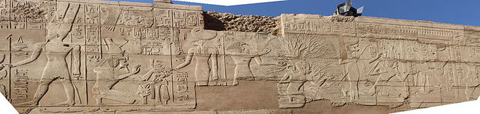 Photograph depicts frieze decorated with reliefs.