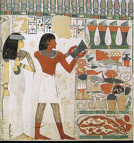 Painting depicts Nakht and his wife Tawy making an offering. Tawy wears a white dress. Nakht wears a short white skirt and adds a vase to a large display of food, dishes, and other treasure.