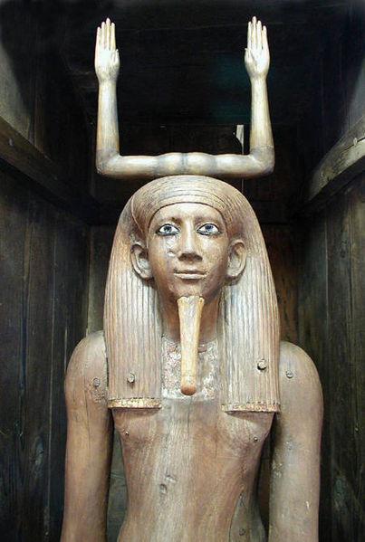 Statue depicts the pharaoh Hor from the waist up. Behind him, two upraised arms top his head, forming the hieroglyphic sign for his name.