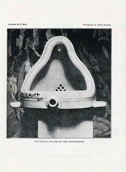 Photograph depicting a porcelain urinal, which is signed 