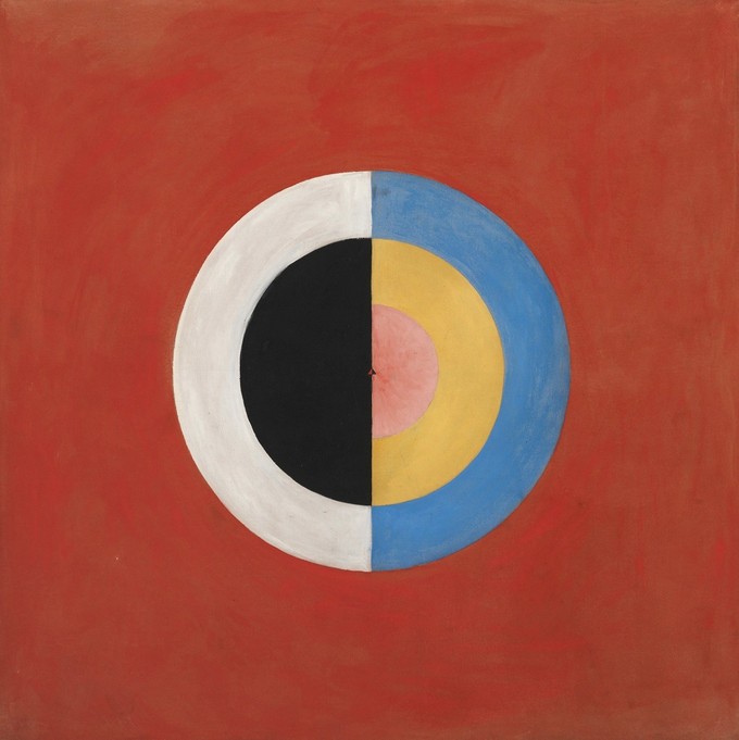 An abstract painting of a segmented bisected circle. One side is black and white. The other is multi-colored.