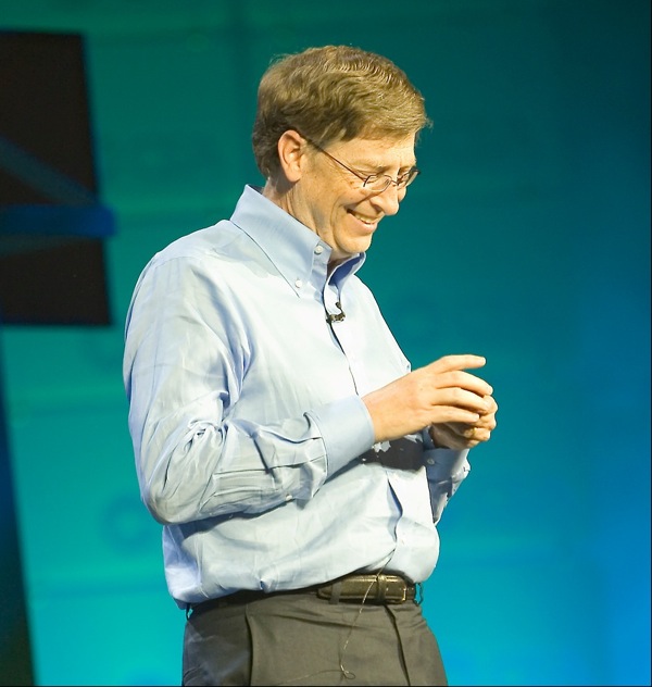 Bill Gates speaking on a stage.