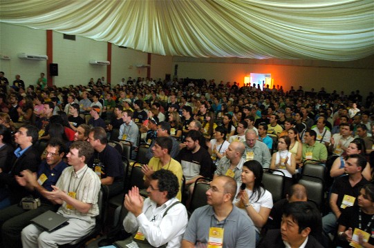 An audience clapping at a conference.